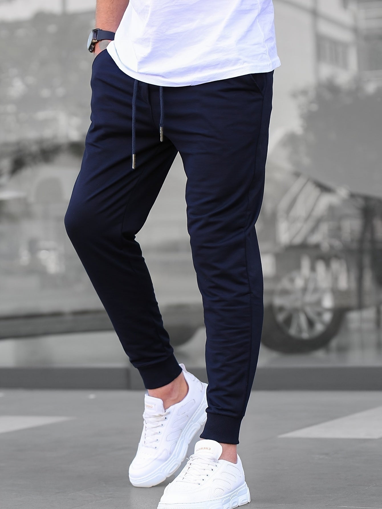 Solid color jogger pants for men with drawstrings, lightweight and breathable for running and fitness.