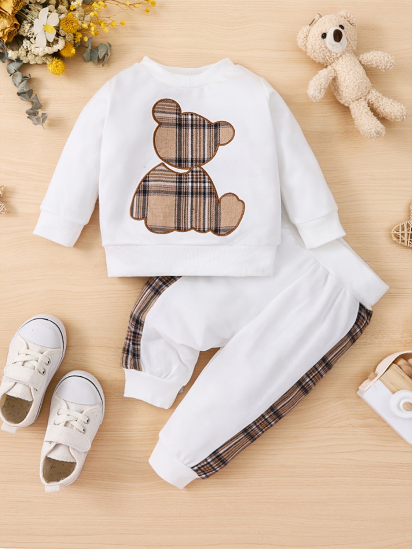 Toddler boy's outdoor fall/winter outfit with long sleeve sweatshirt and casual pants.