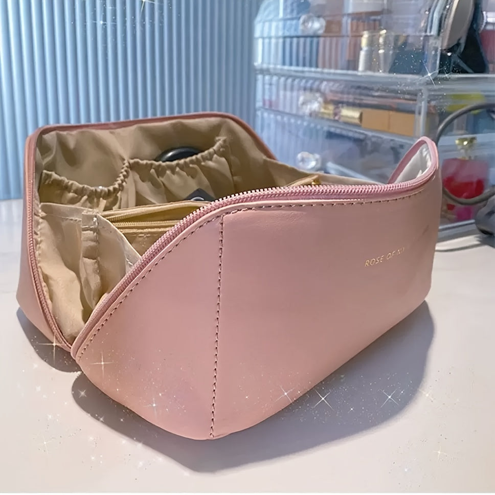 Large travel makeup bag with waterproof, portable design and divider for organizing makeup.