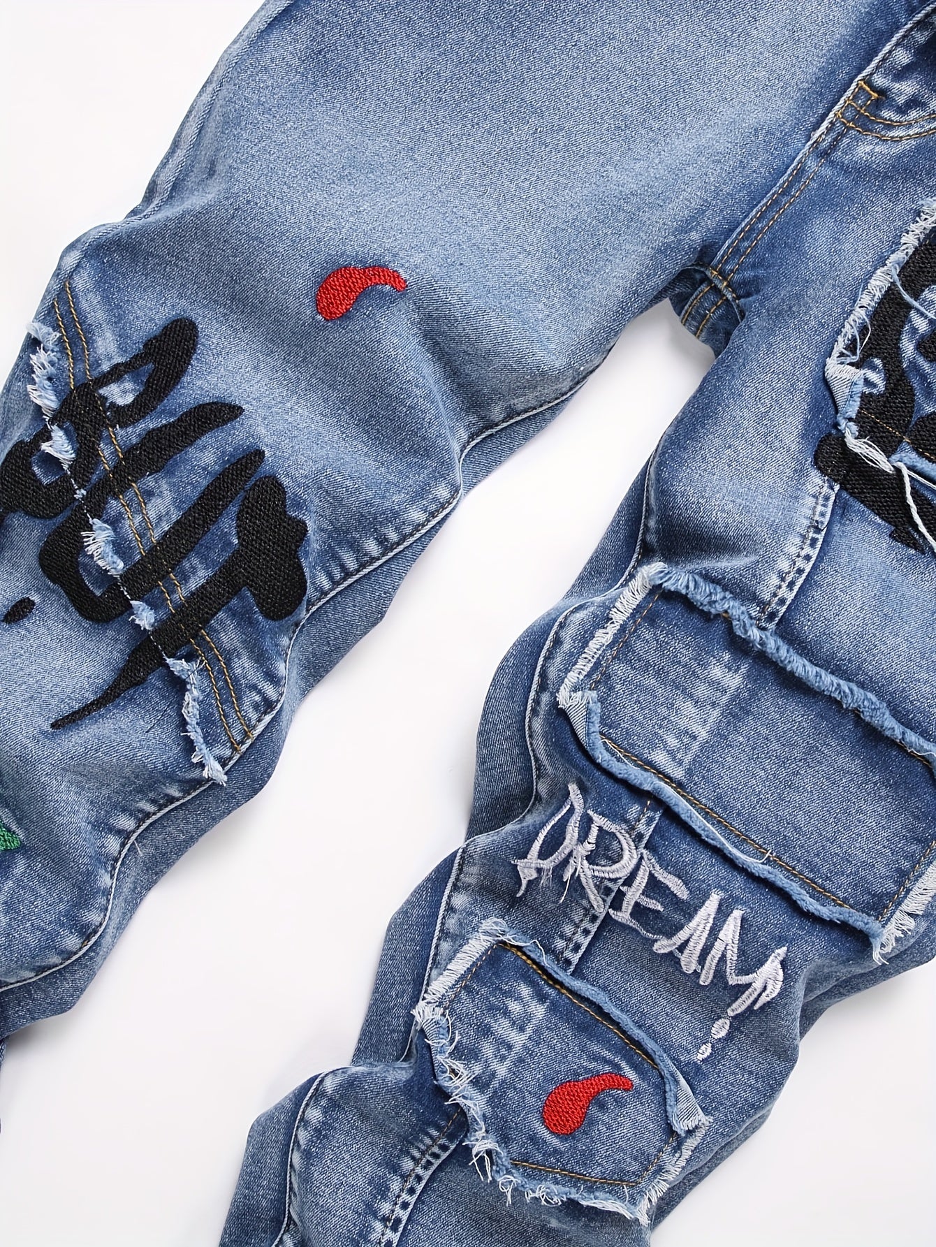 Boys' trendy embroidered graffiti jeans in stretch cotton blend denim with elastic waistband and cuffs, machine washable.