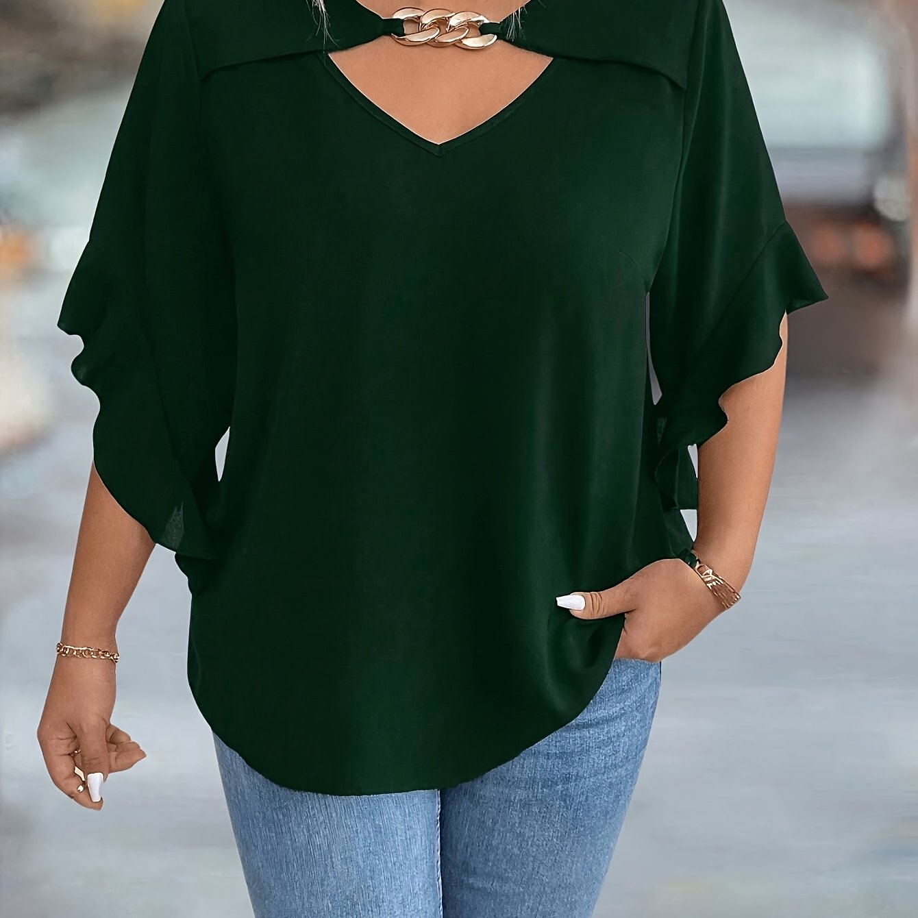 Stylish black V-neck tops for plus-size women in new summer collection.