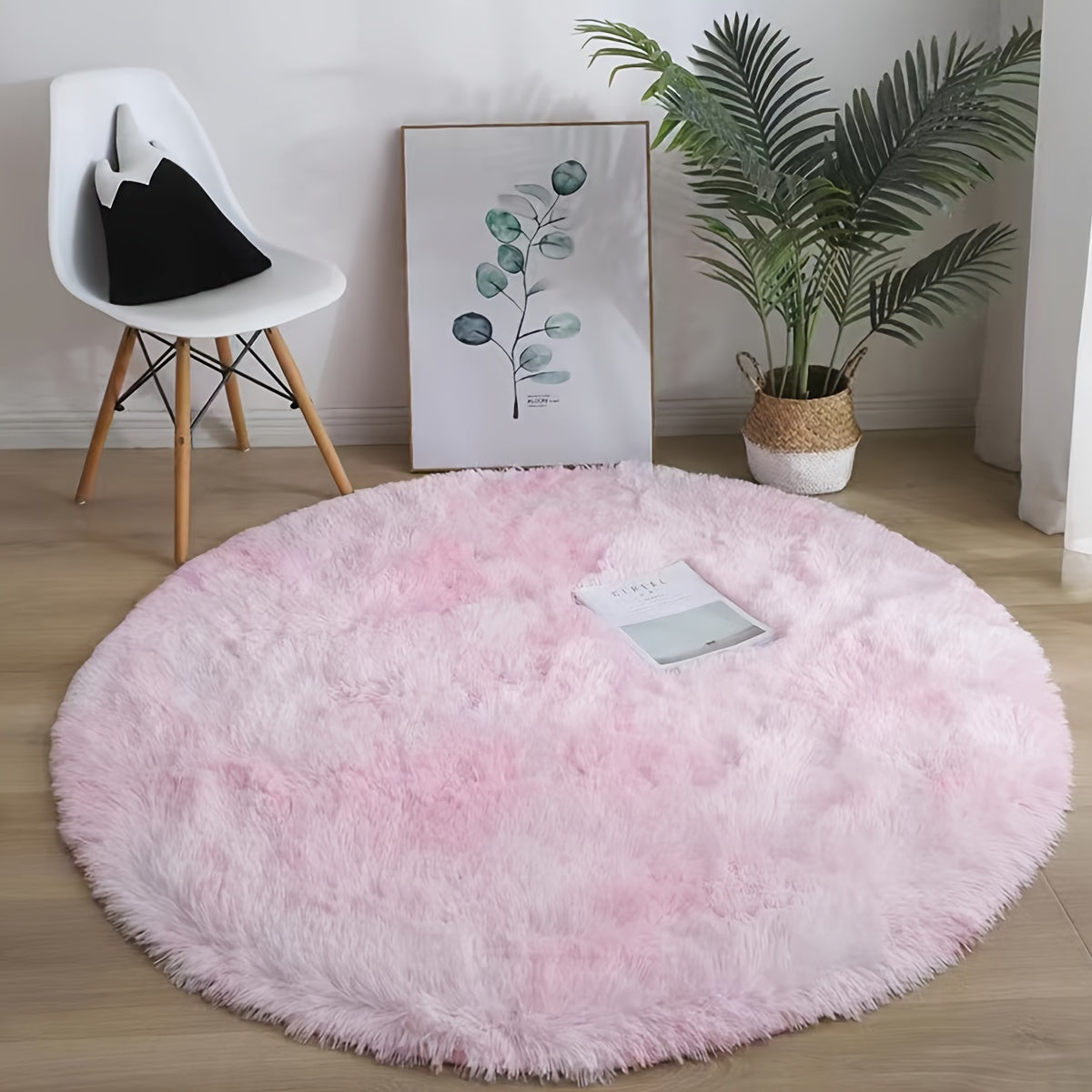 This cozy round area rug is perfect for adding a touch of softness to any room. Made with plush faux fur and lightweight knit polyester fiber, this super fluffy round mat has a rubber backing for extra durability. With a low pile and machine-made