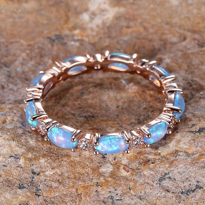 Infinity ring made of high-quality S925 sterling silver with round opal pave, suitable for both men and women to complement everyday outfits. This jewelry piece weighs 2.5g/0.09oz.