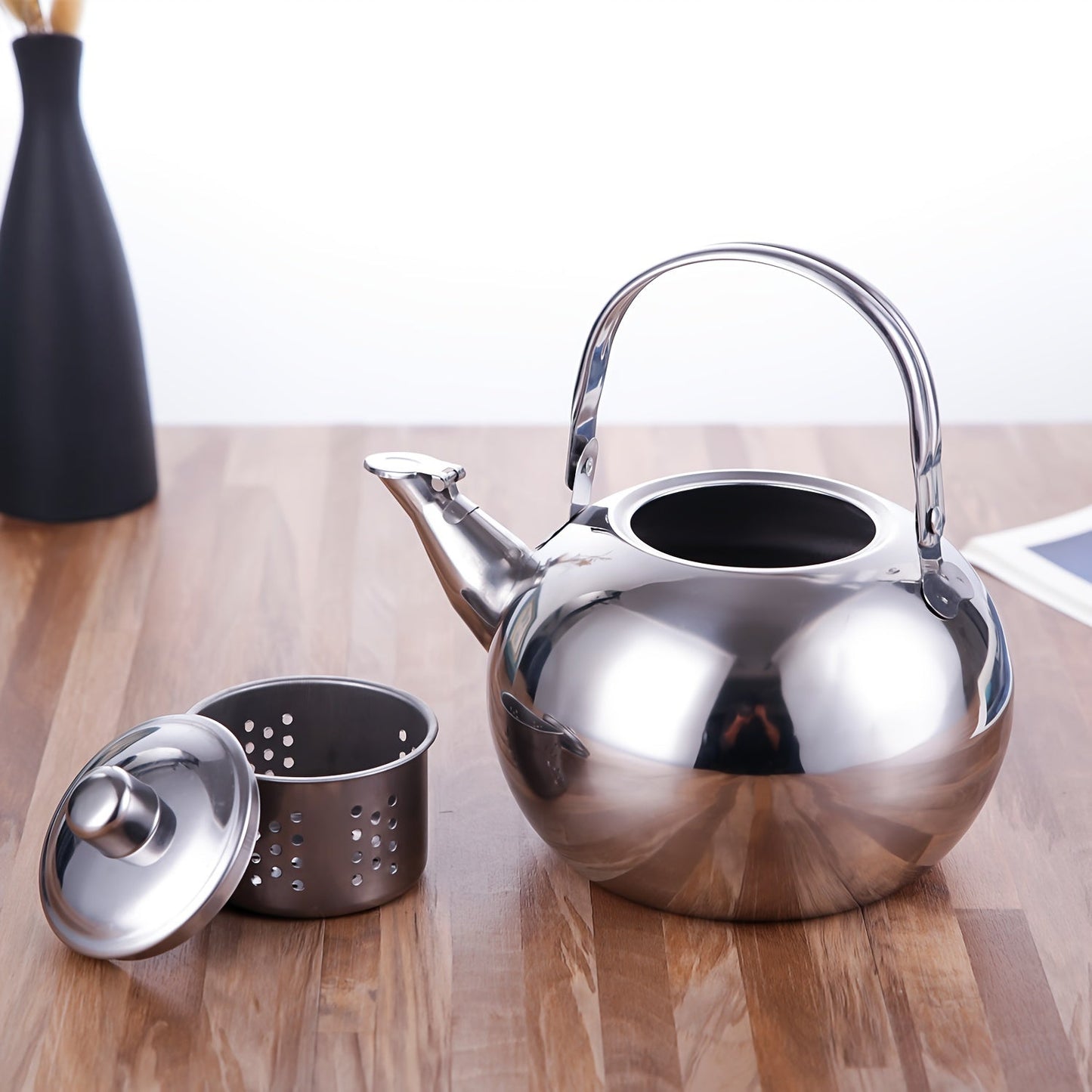 The Stainless Steel Teapot includes an Infuser for a flawless brewing experience of Coffee and Green Tea, suitable for both Home and Office settings.