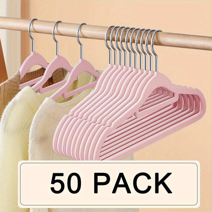 Upgrade your wardrobe organization with this set of 50 sleek black velvet hangers. These non-slip hangers feature 360° swivel hooks and a slim design, perfect for suits, coats, dresses, and more. Made from durable ABS plastic, these hangers are ideal for