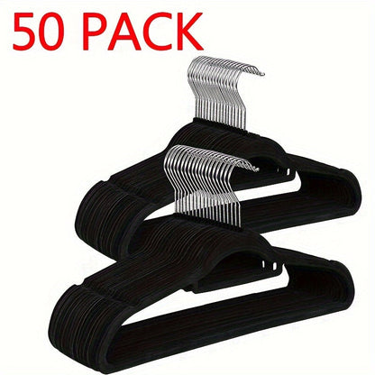 Upgrade your wardrobe organization with this set of 50 sleek black velvet hangers. These non-slip hangers feature 360° swivel hooks and a slim design, perfect for suits, coats, dresses, and more. Made from durable ABS plastic, these hangers are ideal for