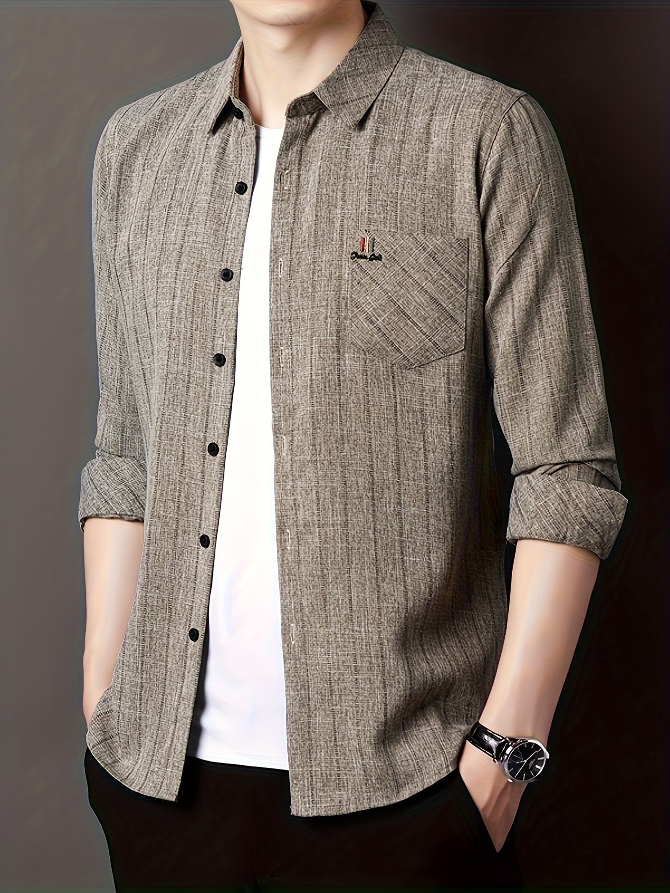 Men's striped shirt with chest pocket, collar, and long sleeves.