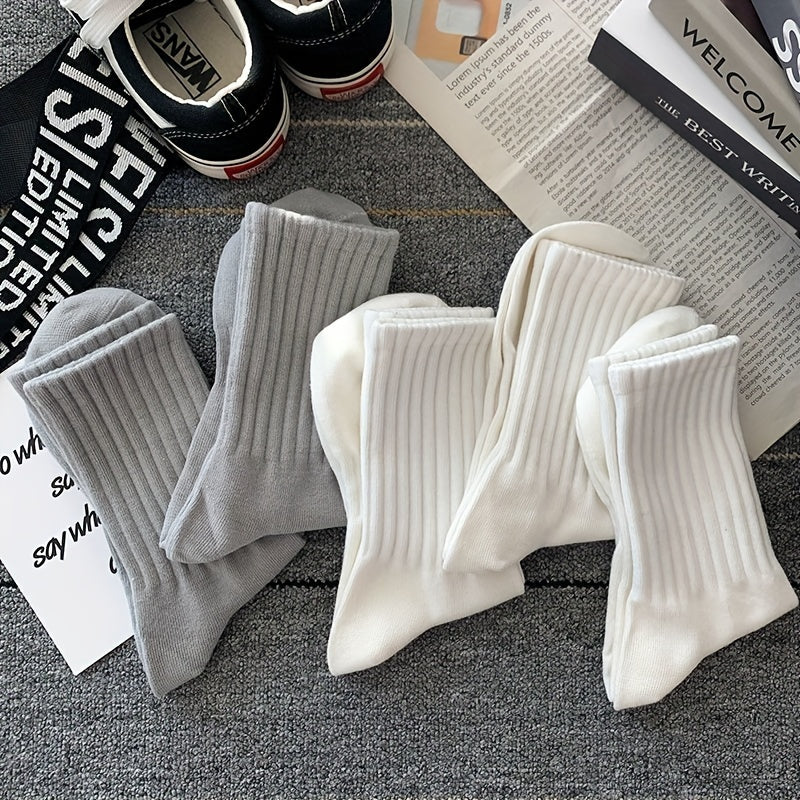 5-Pack of unisex crew socks made with breathable polyester/spandex blend in solid colors that won't fade. Features high waist and sports style, machine washable.