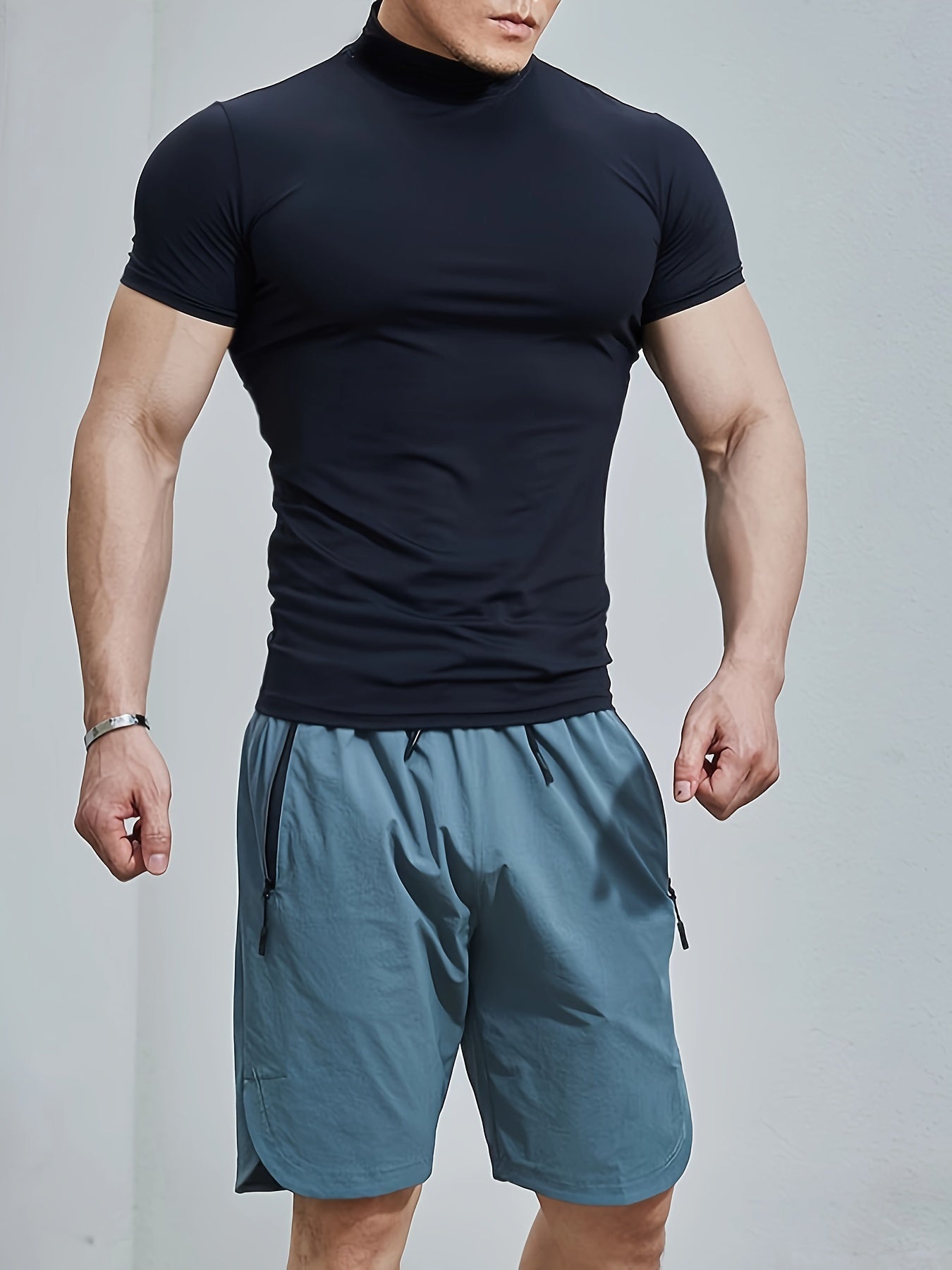 Men's athletic high neck t-shirt with quick dry, compression, and stretch fabric, ideal for training and running.