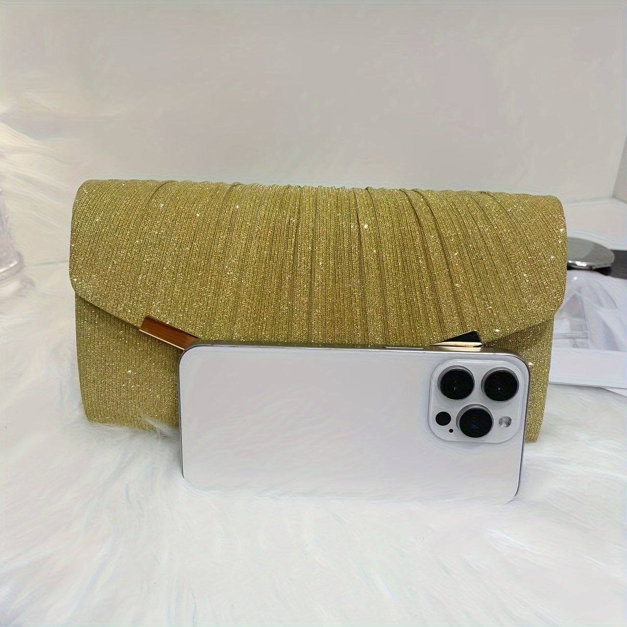 A dazzling envelope clutch adorned with gold accents, ideal for chic women at weddings and parties.