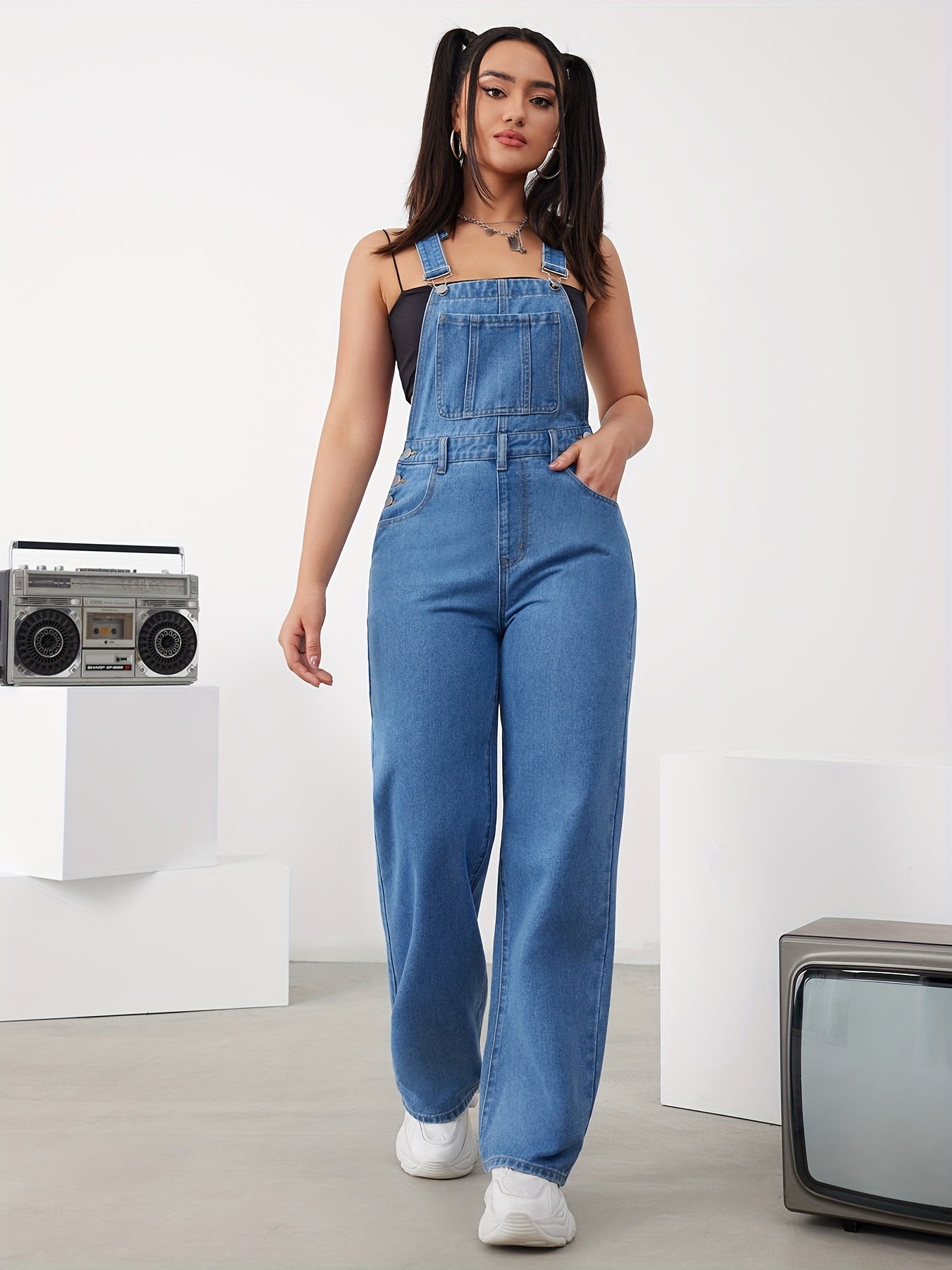 Women's adjustable denim overalls with wide-leg jeans, button detail, and machine washable.