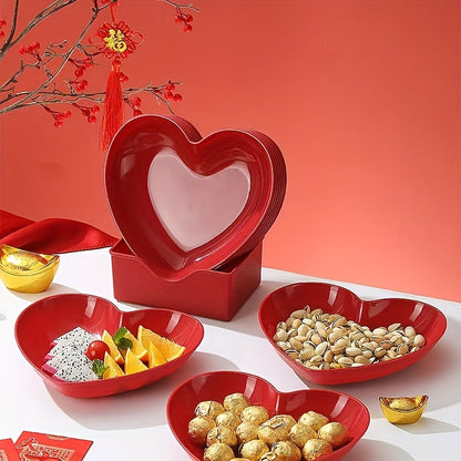 Heart-shaped plastic serving saucers in red for special occasions.