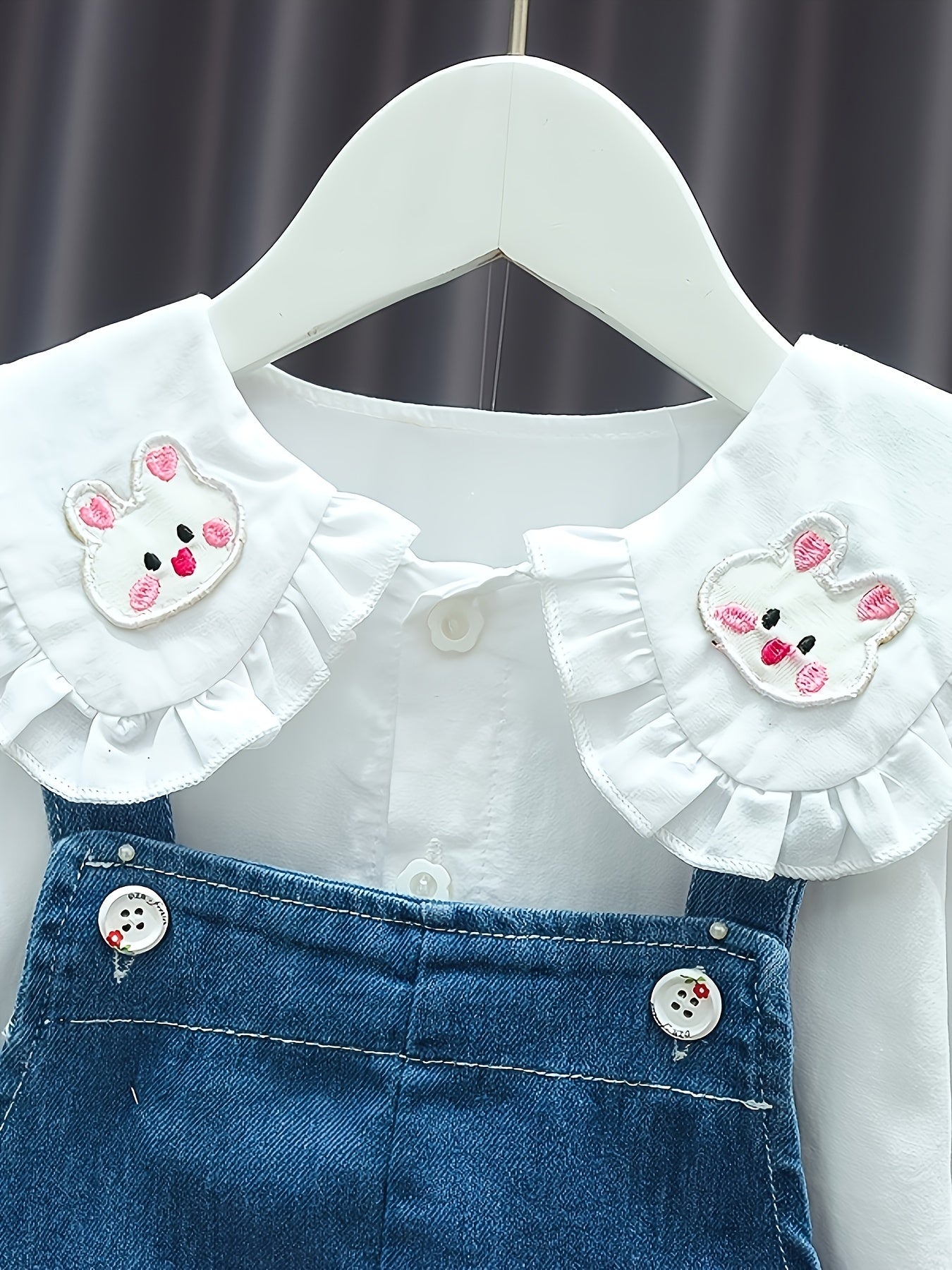 Baby girl's 2-piece denim overalls with rabbit embroidery plus ruffled blouse for spring and fall outdoor wear.