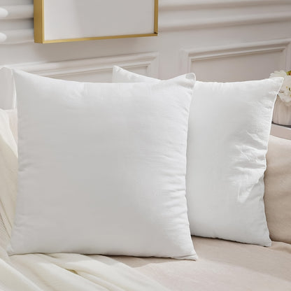 Two contemporary white throw pillow covers measuring at 45.72x45.72 cm made from soft polyester with zipper closure for home décor, machine washable.