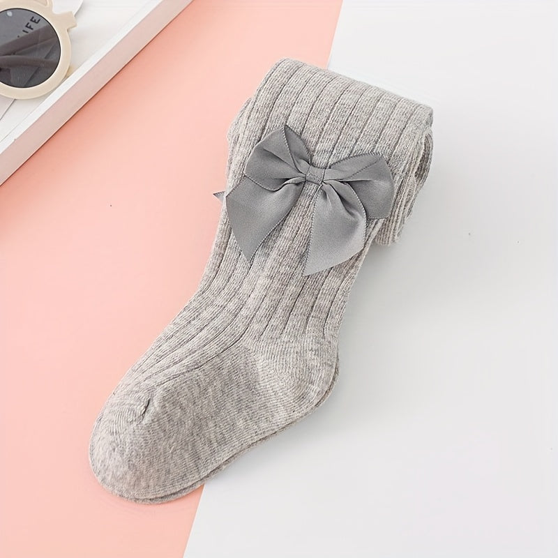 Adorable bow-knot girls' leggings socks in soft ribbed knit, perfect for dance and casual attire. Available in various colors.