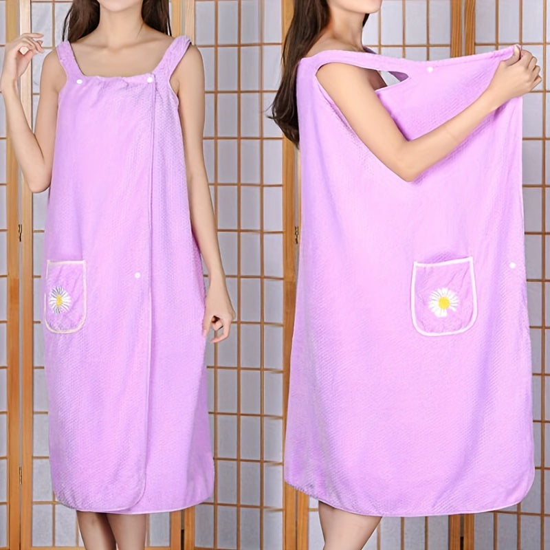 Adults' wearable bath towel features pockets, buttons, and quick-drying, absorbent material. Perfect for home spa or sauna use.