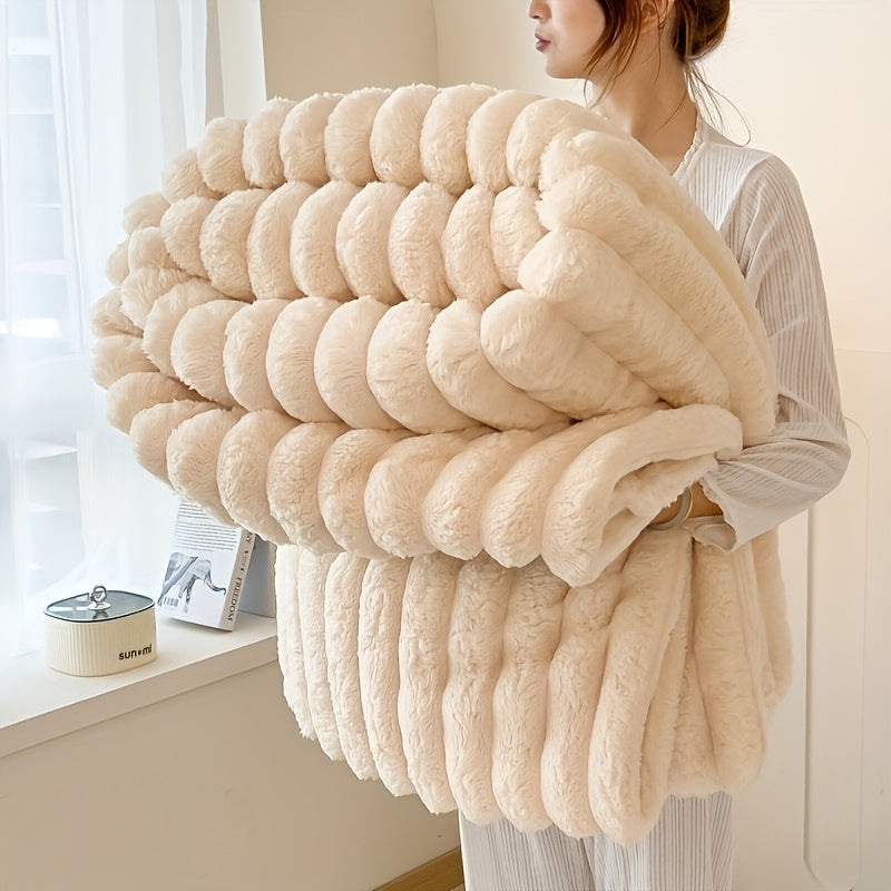 Soft, warm, and luxurious, this contemporary double-sided faux rabbit fur throw blanket is perfect for cuddling up on the couch or bed. Made of polyester knit, it is machine washable for easy care. Whether you're at home or on the go, this all-season