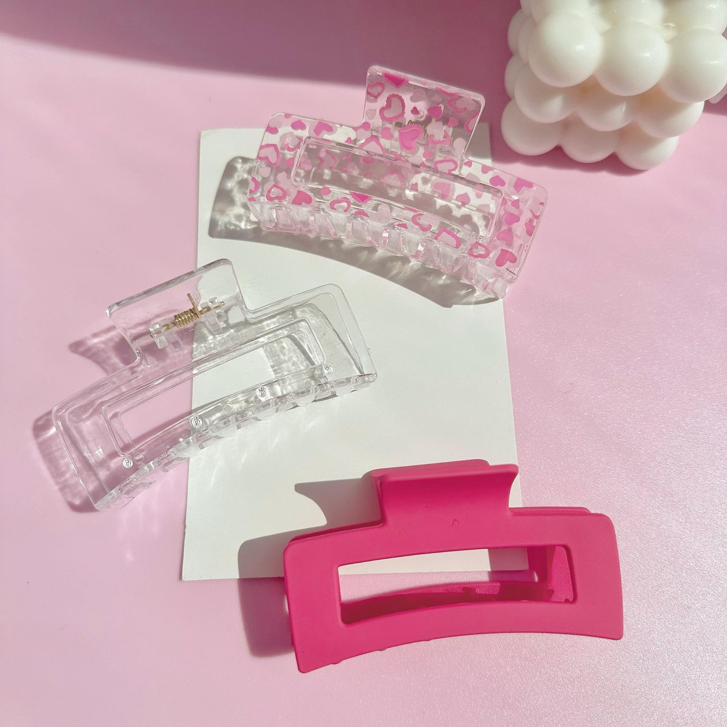 High-end and fashionable dopamine style claw clips in pink love and rose red patterns, rectangular plastic hair grippers. Suitable for daily wear, outings, hair styling, washing face