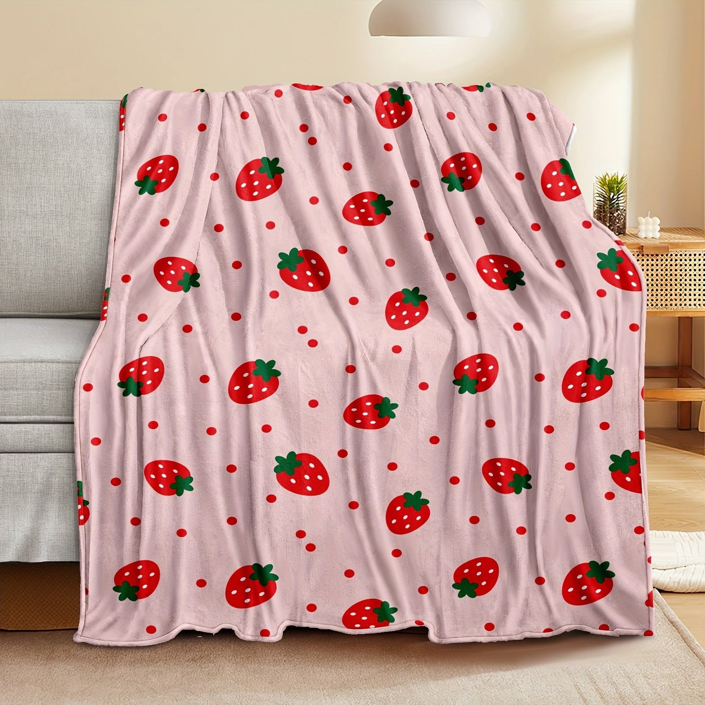 One piece of a strawberry printed throw blanket, perfect for bed, sofa, office, camping, or traveling. This soft and cozy blanket is versatile and makes a great gift for all seasons.