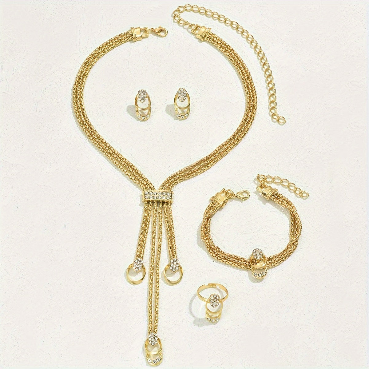 Vintage Boho 4-piece jewelry set with glass and alloy details, perfect for weddings or gifting. Includes necklace, bracelet, earrings, and ring.