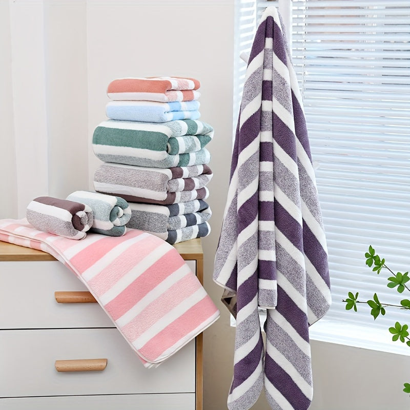 Modern 4-piece coral fleece towel set with geometric pattern, made of 100% polyester for softness and quick-drying absorbency. Ideal space-themed bathroom essential.