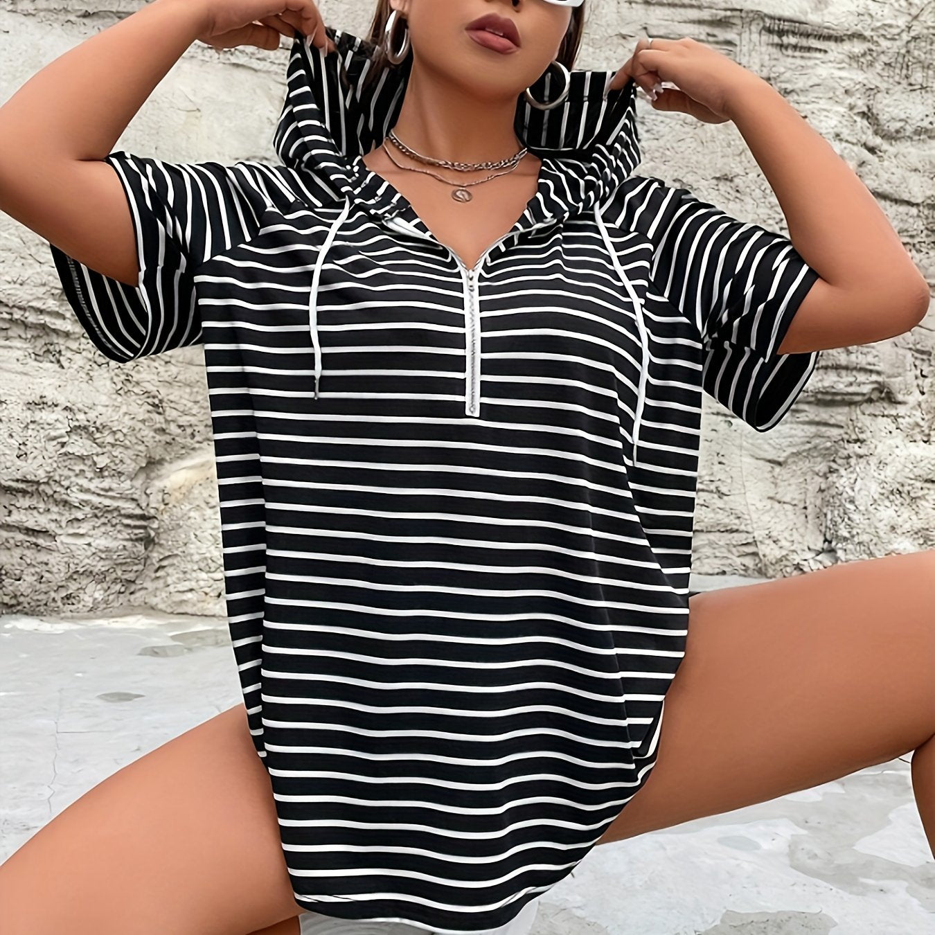 Women's red and white striped hooded T-shirt with zipper, drawstring, and kangaroo pocket. Made of polyester spandex blend knit fabric, relaxed fit for spring/summer collection.