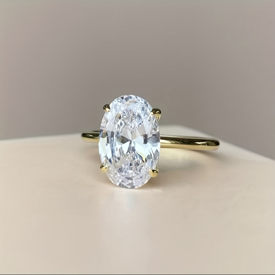 Simple and elegant 14K gold plated S925 silver ring featuring an oval cut synthetic cubic zirconia in 1CT, 2CT, or 3CT. Perfect for daily wear or as a thoughtful gift.