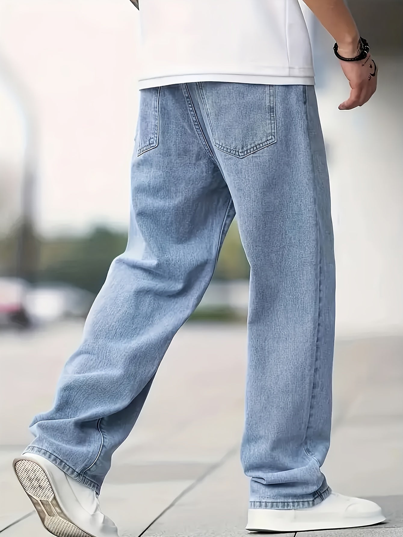 Men's loose fit denim jeans made of 65% cotton and 35% polyester with a solid color washed fabric, suitable for all seasons. These non-stretch regular length pants are woven.