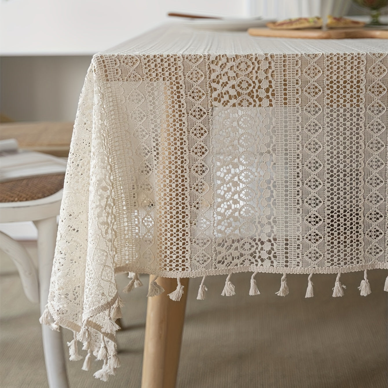 Bohemian chic crochet lace tablecloth, ideal for dining and parties. Rectangular polyester design with a farmhouse style, perfect for boho home decor. Great for buffet tables, banquets, and serving western food.