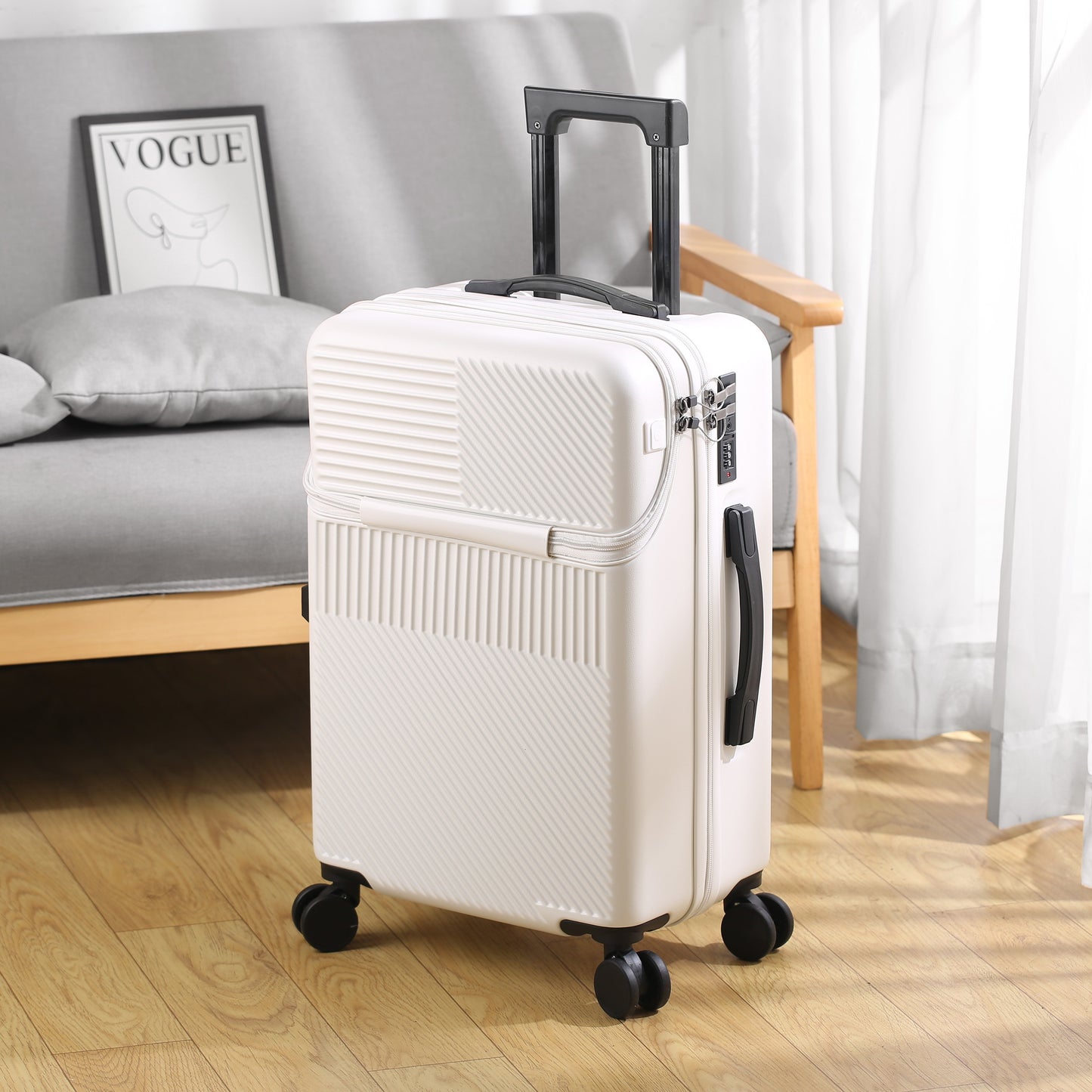 Compact 20-inch carry-on with cup holder and retractable handle.