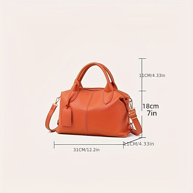 Stylish shoulder bag with removable strap and zip closure, perfect for everyday use.