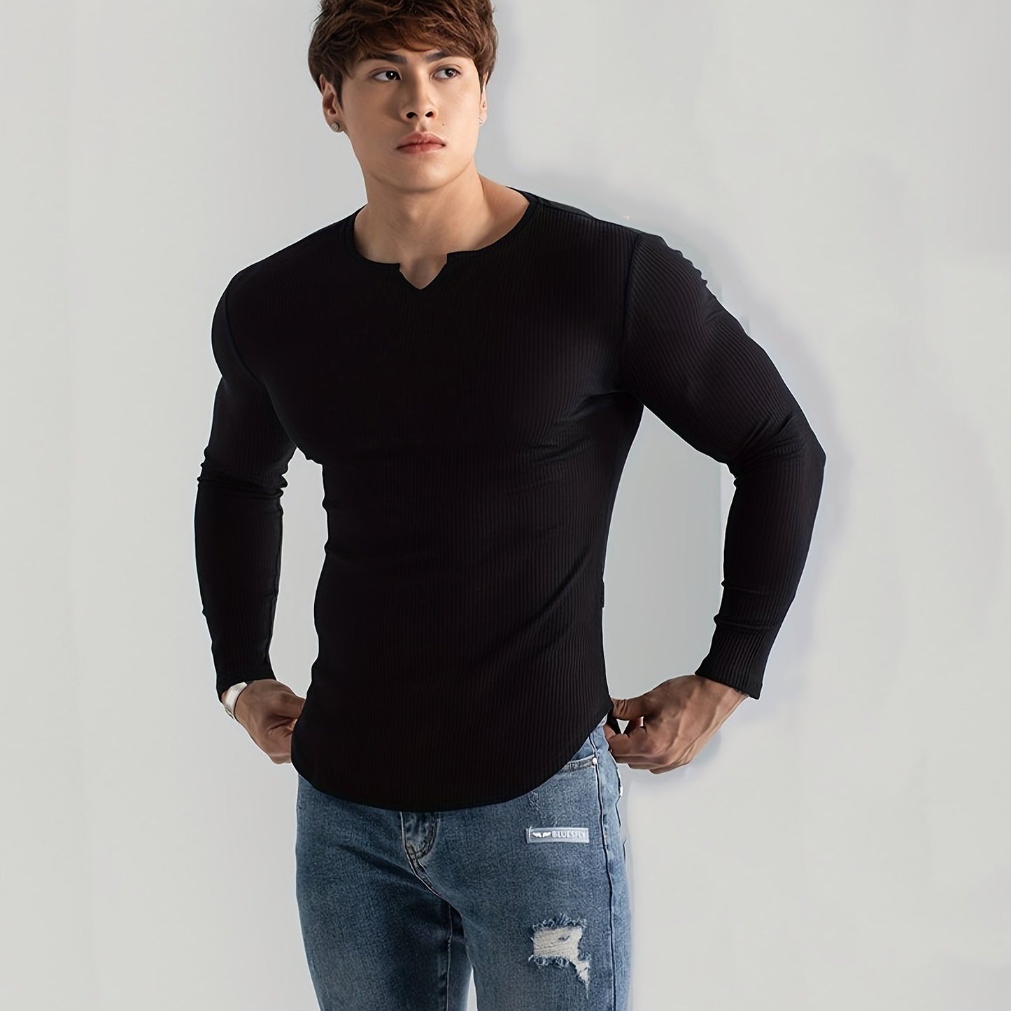 Men's solid color long sleeve V-neck t-shirt for comfortable and casual wear in spring and fall outdoor activities.