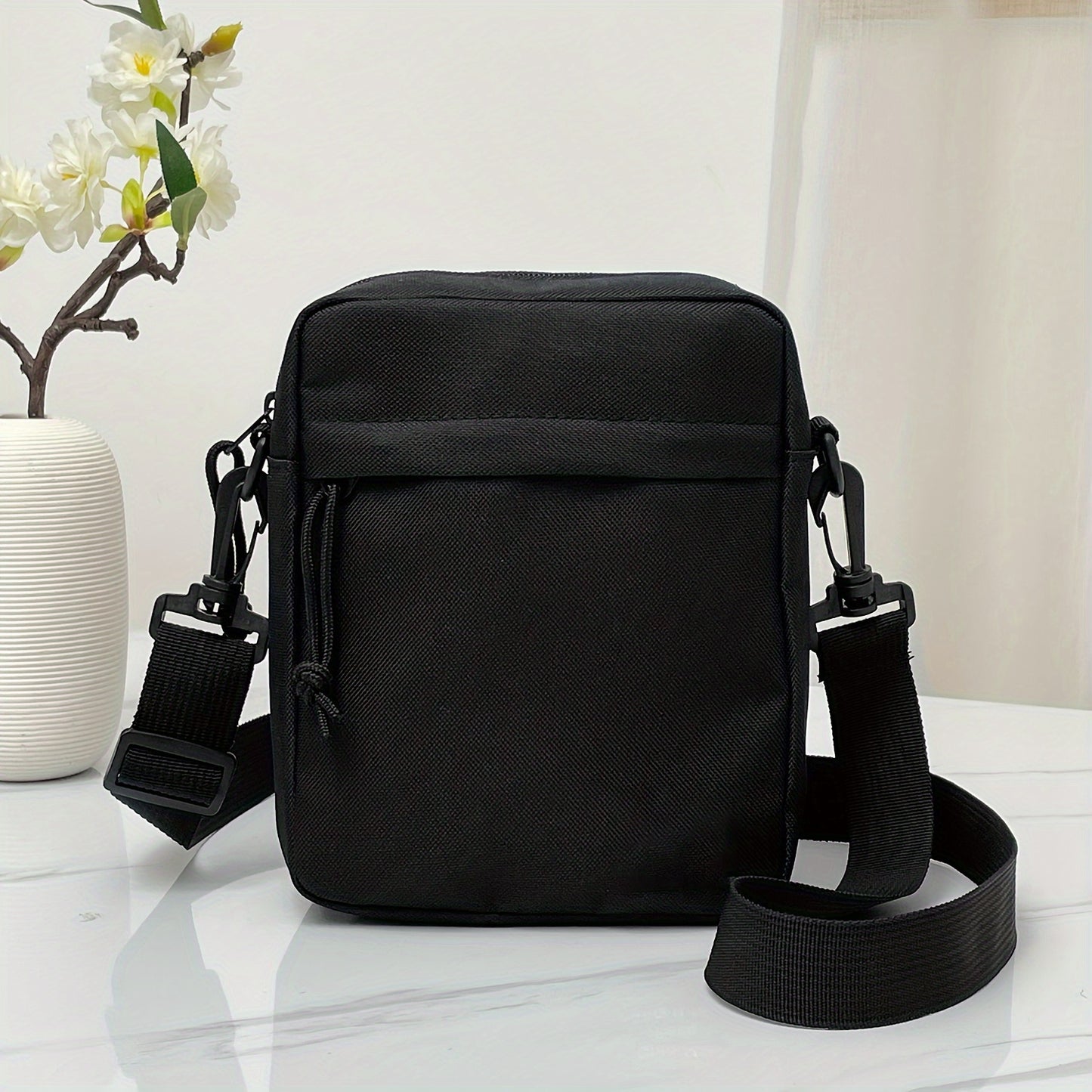 Fashionable and simple men's shoulder bag made of nylon, suitable for casual wear.