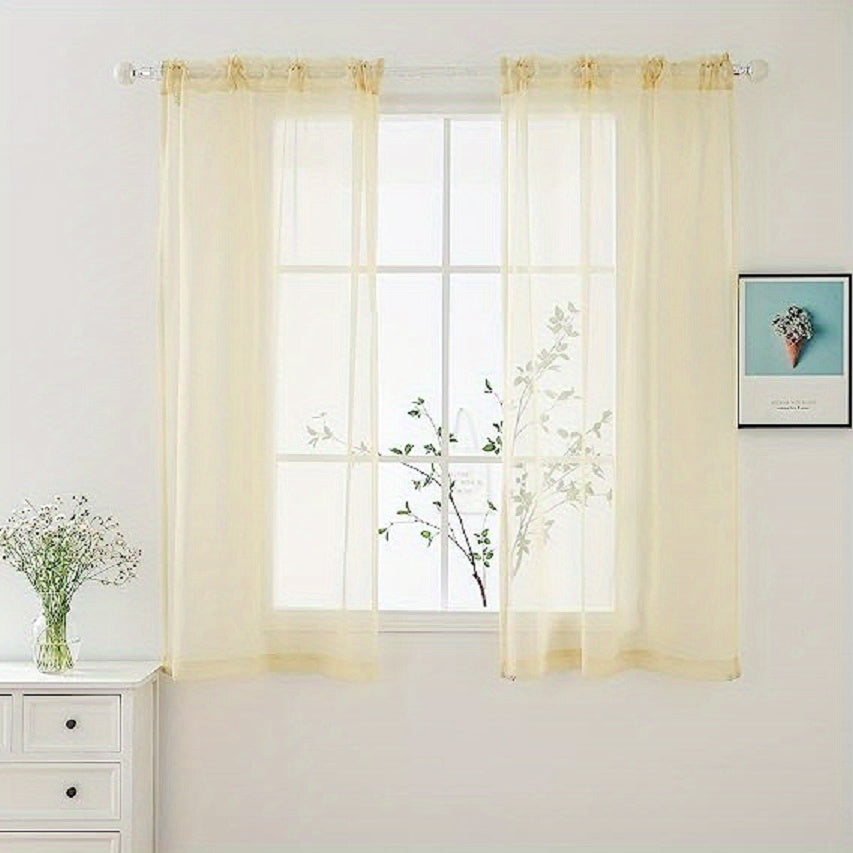 Two panels of sheer curtains with a basic rod pocket design, perfect for adding a touch of elegance to your bedroom, office, living room, yard, kitchen, or any other space in your home.