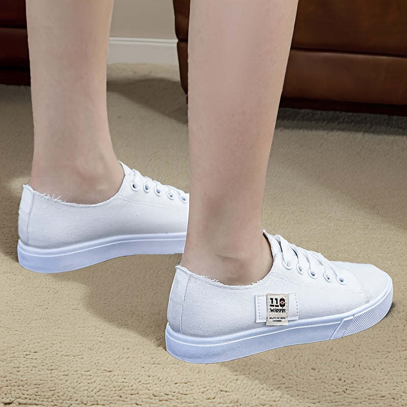 1 pair of women's casual canvas sneakers with round toe, lace-up design, lightweight rubber sole, and fabric insole.