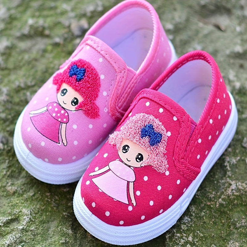 Adorable pink polka dot slip-on canvas shoes for girls featuring cute cartoon embroidery, breathable fabric, lightweight and comfortable for spring and fall. Durable TPR sole and easy