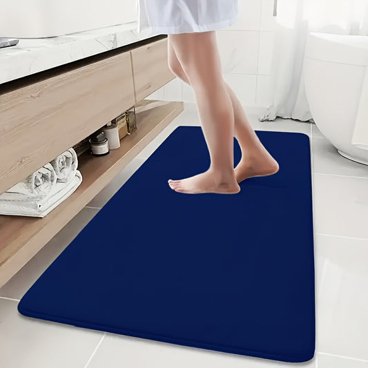 Soft and absorbent sponge bath mat with non-slip coral fleece for shower, bathtub, and home decor in gray color.