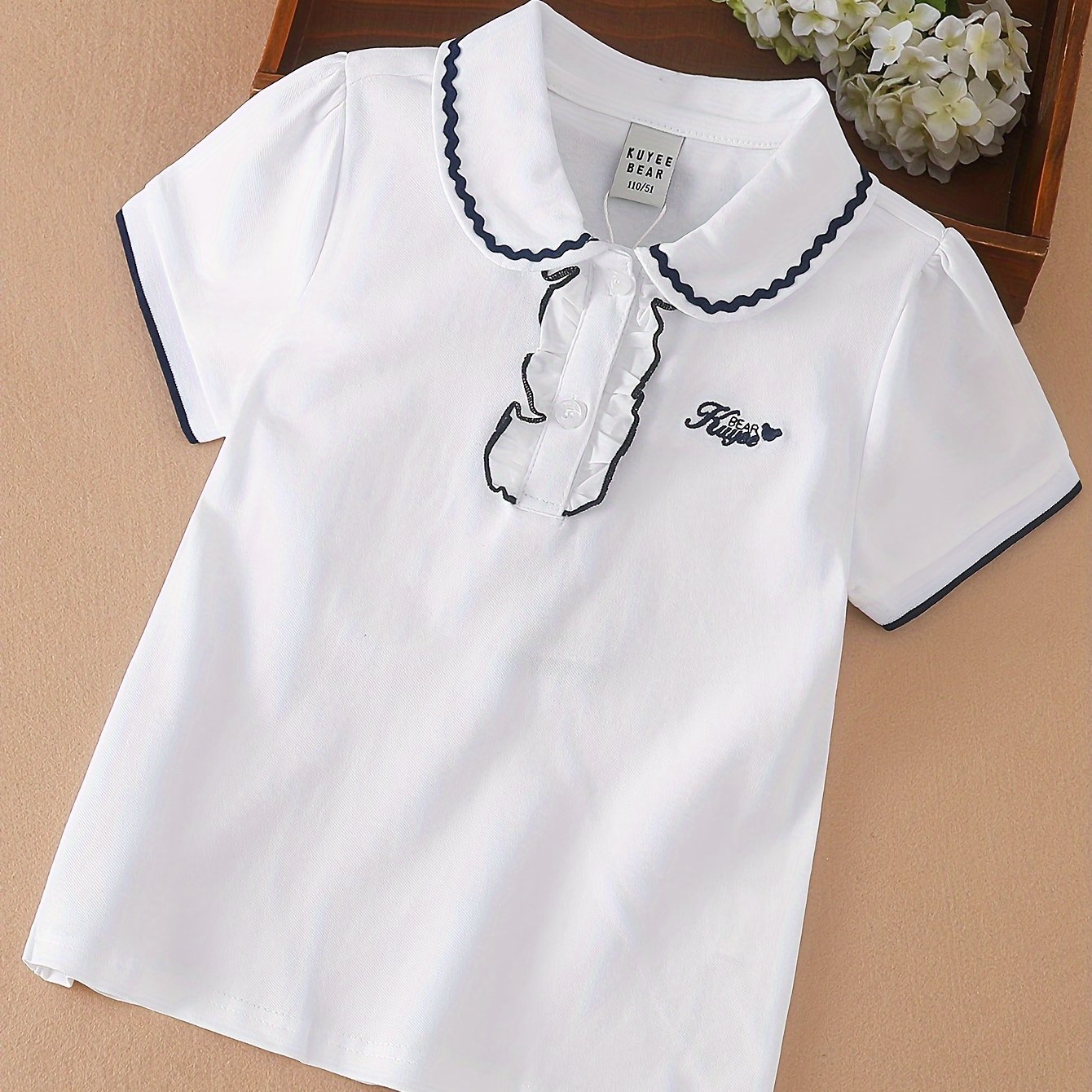 Stylish lace detail on cotton blend girls' shirt - perfect for summer casual wear.