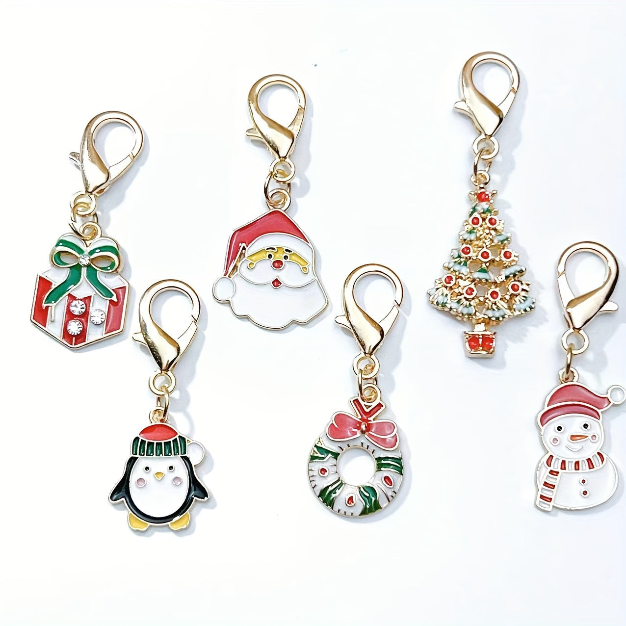 Six Christmas keychain charms made of zinc alloy with festive keyrings. These non-plated metal bag pendants are simple in style and perfect as holiday gifts for friends.