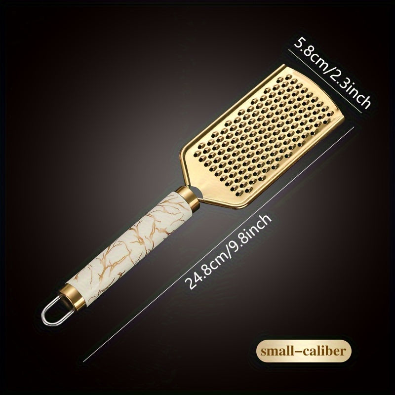 Stainless steel kitchen grater for shredding various foods, with a safe handle and luxurious golden appearance.