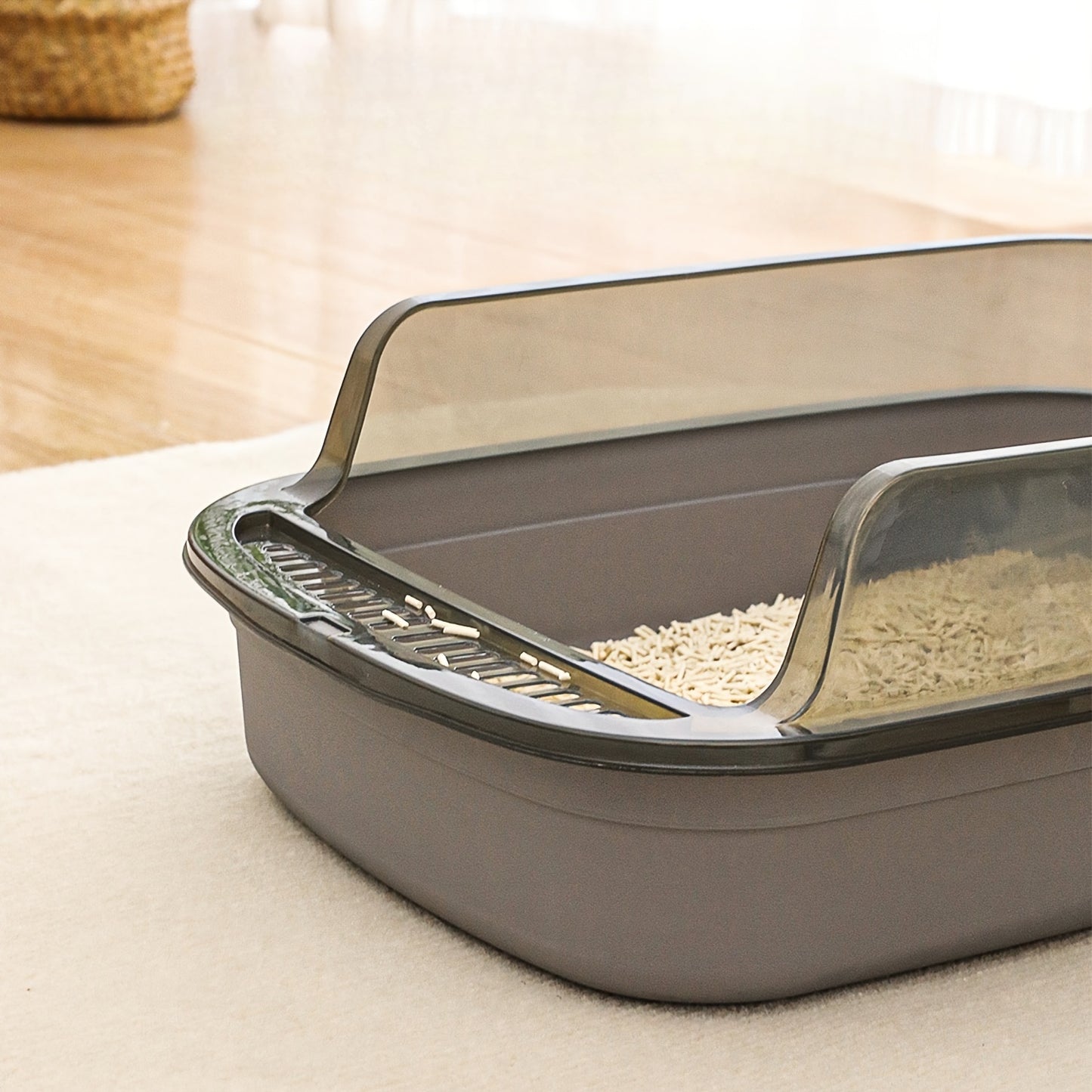 Semi-enclosed litter box for small to medium cats made from durable silicone and PP material with easy-clean design and high sides. Comes with ventilated pan and metal shovel.