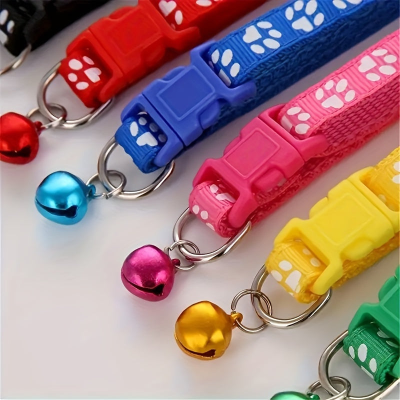 10 adjustable nylon pet collars with bells featuring vibrant cartoon paw & footprint design for dogs and cats