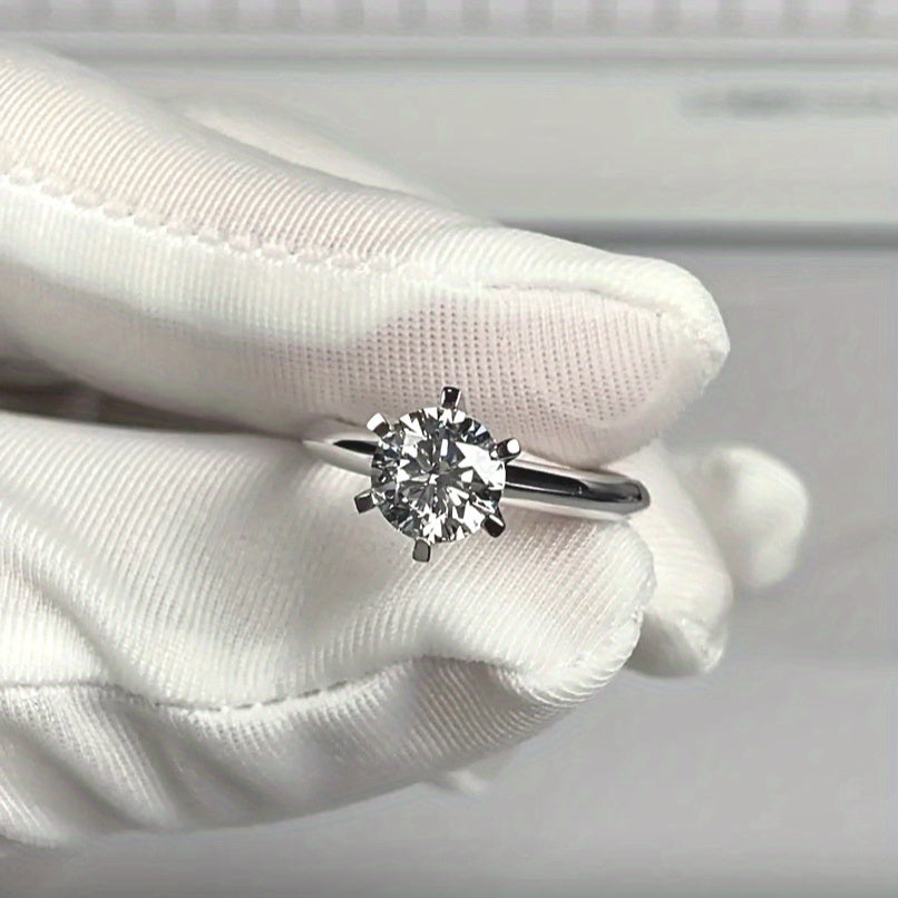 A stunning 925 silver ring with a 0.5 carat Moissanite stone in a six-prong setting. Perfect for both everyday wear and special occasions like engagements and weddings.