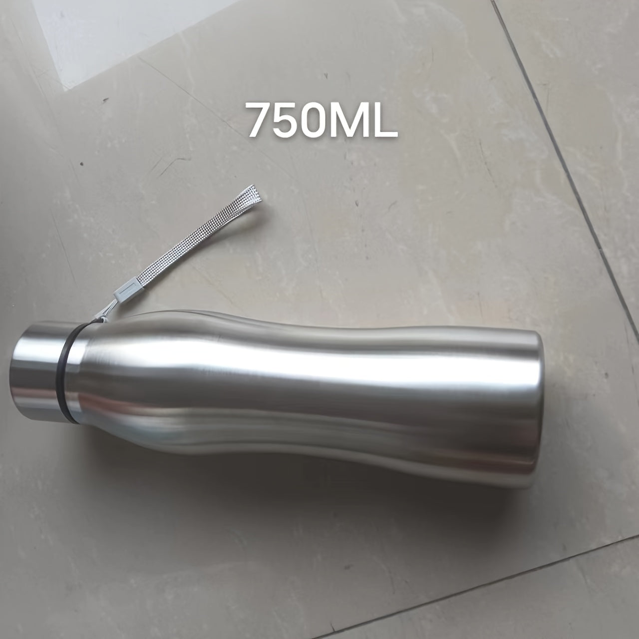 Large capacity stainless steel water bottle with steel cap, anti-shatter, PVC-free, portable and suitable for home, kitchen, travel, and outdoor use. Hand wash only. Oval shaped.