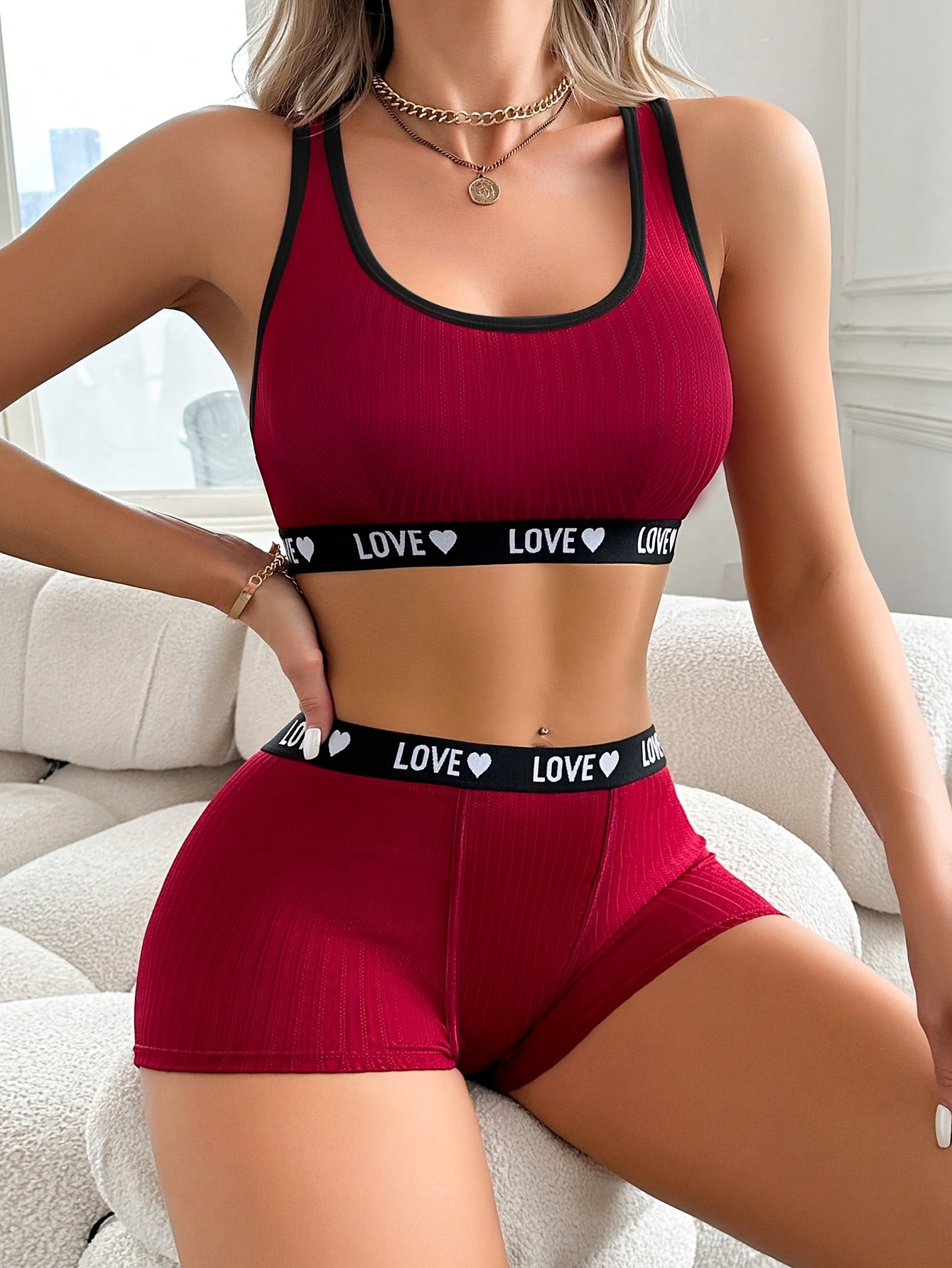 Athletic-inspired lingerie set for women featuring a tank bra and boyshorts with letter print and contrast trim.