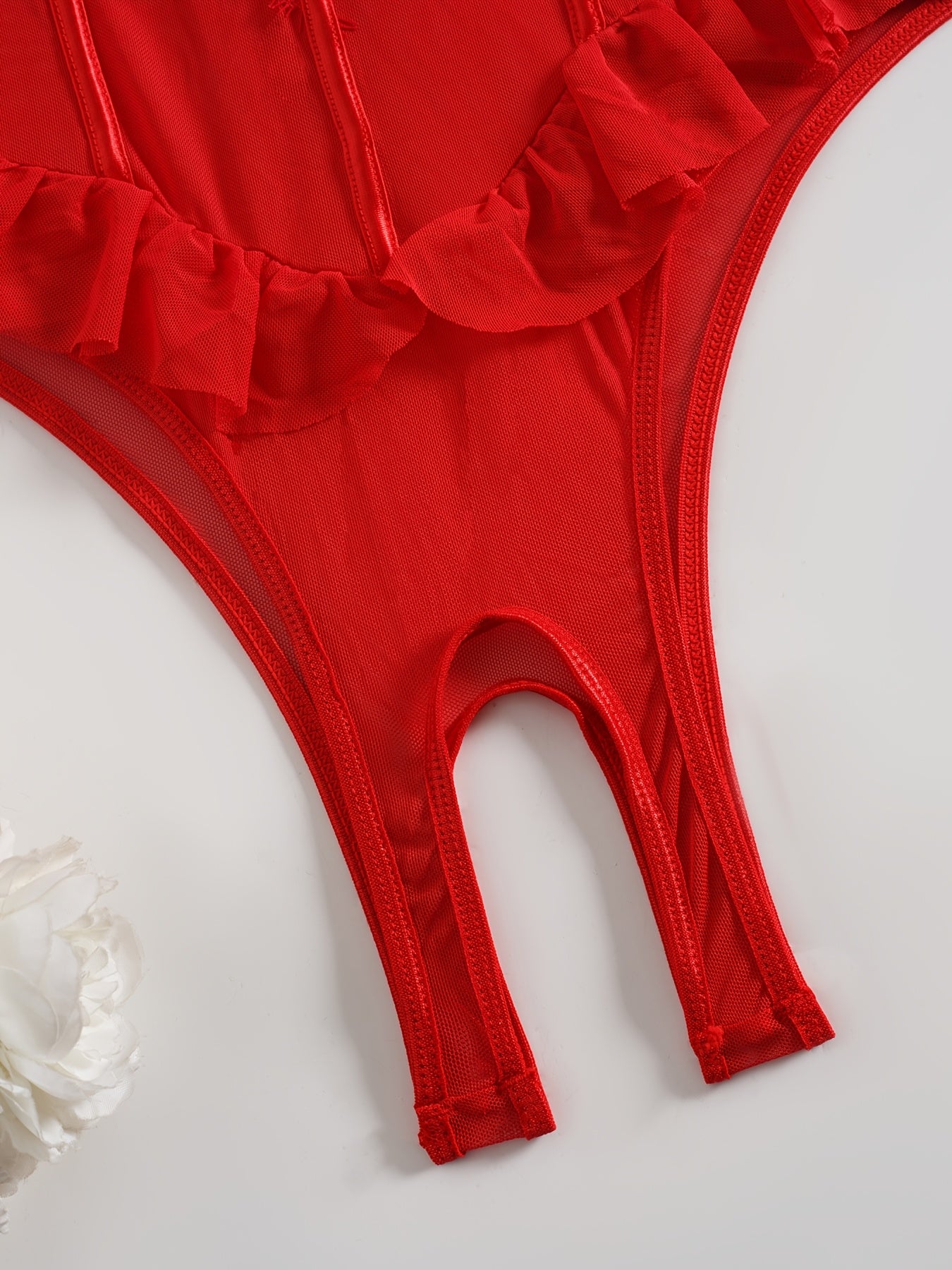 Red lace velvet teddy with ruffled detailing, underwire support, and high-cut, backless design. Features floral lace patterns, adjustable straps, and semisheer texture with lace trim.