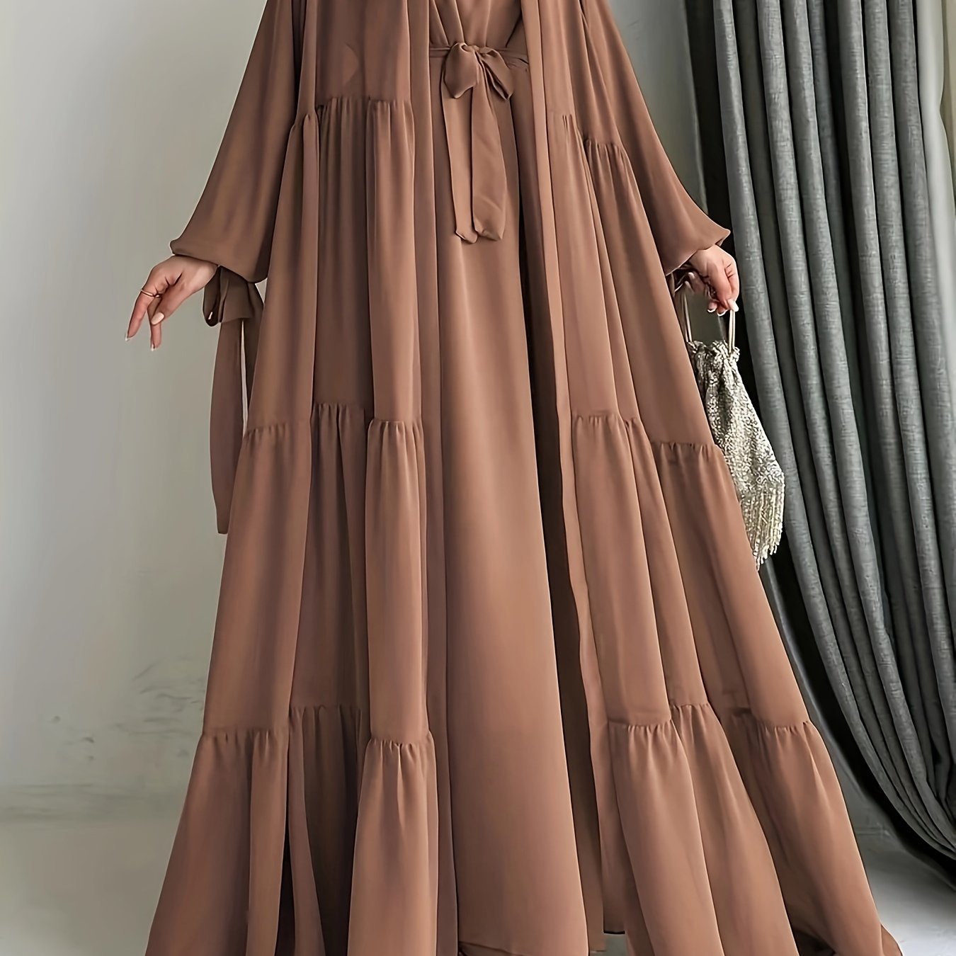 A stylish Middle Eastern Abaya set with vest and belt, featuring a chiffon H-Line robe with side split, lantern sleeves, and ruffle hem detail - perfect for all seasons.