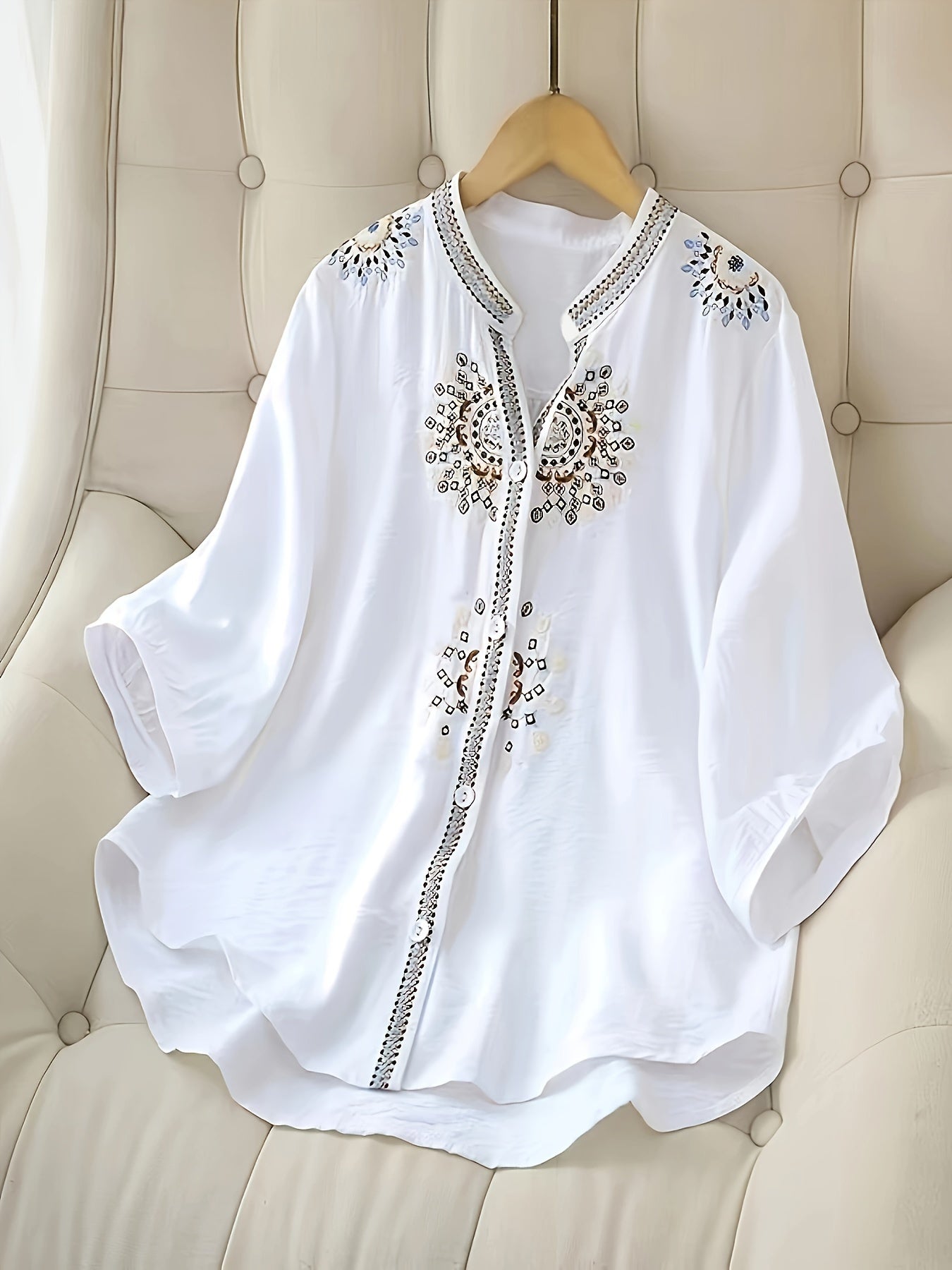 Embroidered short sleeve blouse with stand collar for women, made of breathable polyester, machine washable, semi-sheer.