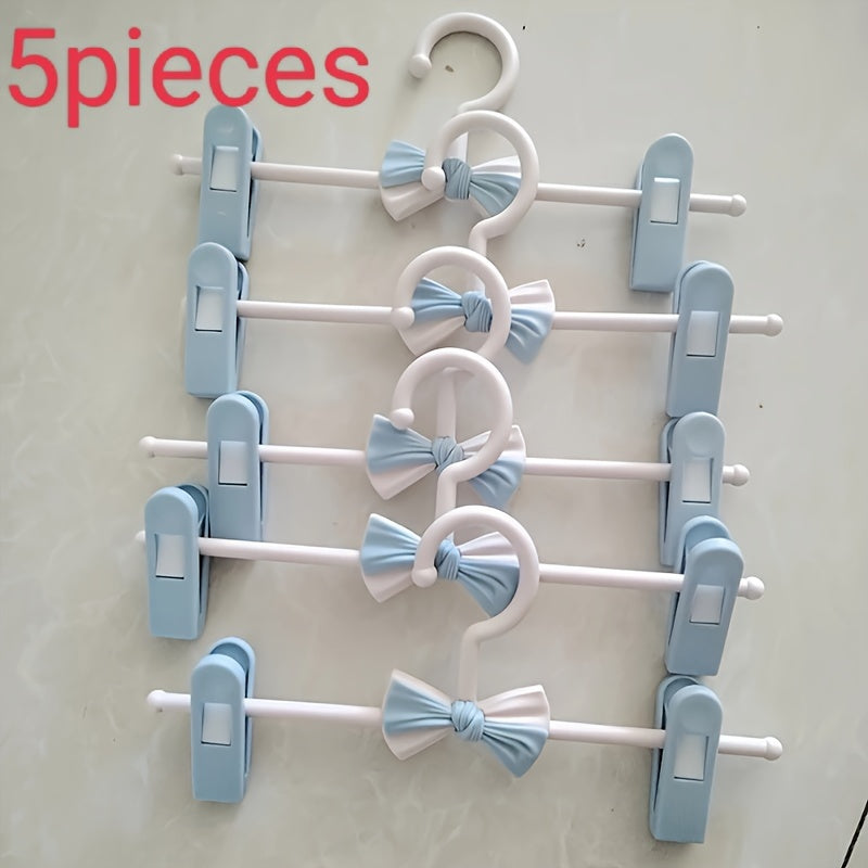 Convenient 27.94-68.58 cm Retractable Plastic Pants Hanger with Bow Clips - Ideal for Children's Clothing