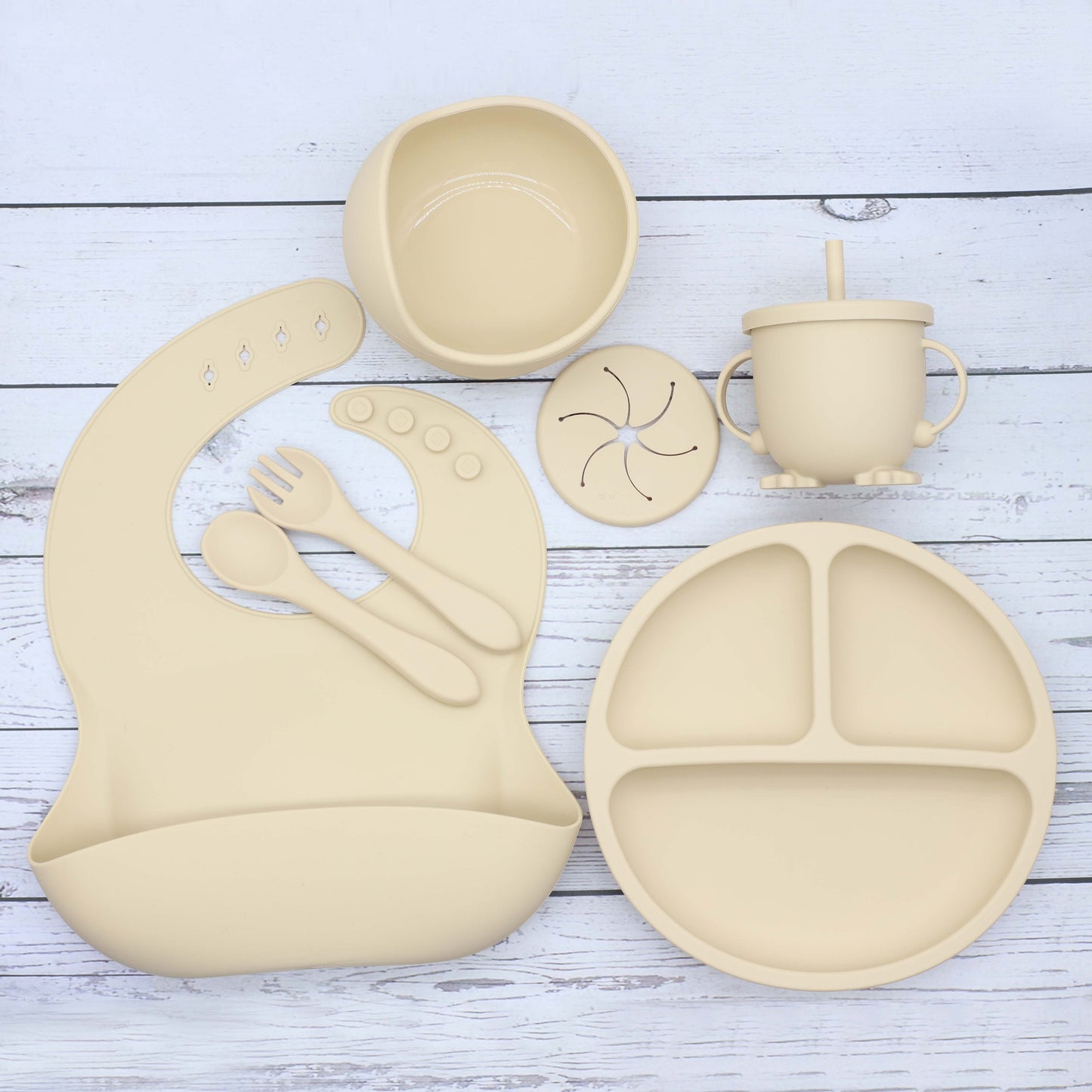 6 piece set of Silicone Feeding Items, featuring a Silicone Bib, Silicone Suction Plate, Silicone Suction Bowl, 2-in-1 Drinking Training Cup. Made of soft and safe, food-grade silicone that is BPA-free. Perfect Easter gift idea.